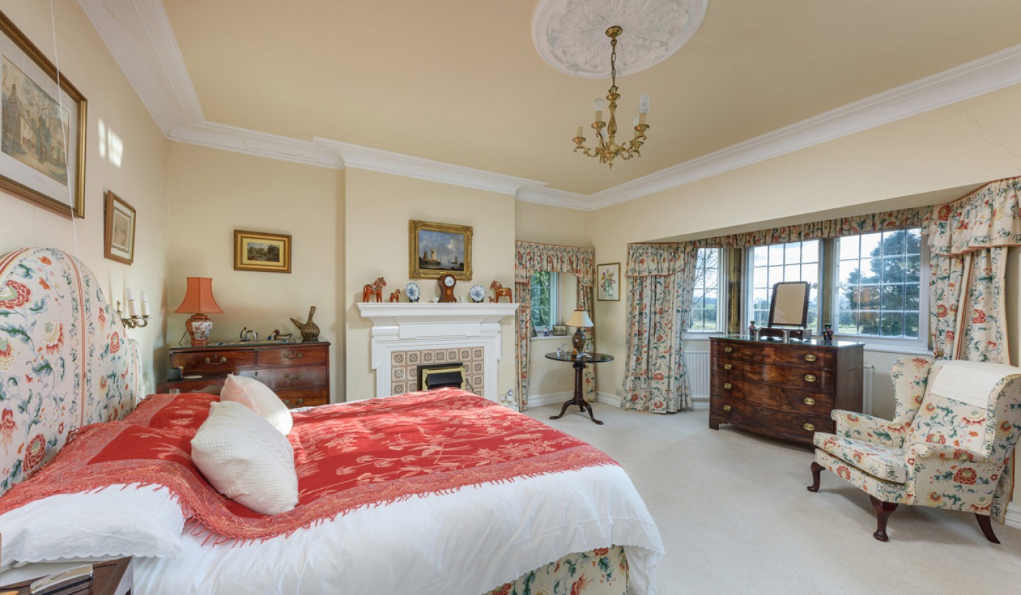Large master bedroom with period features